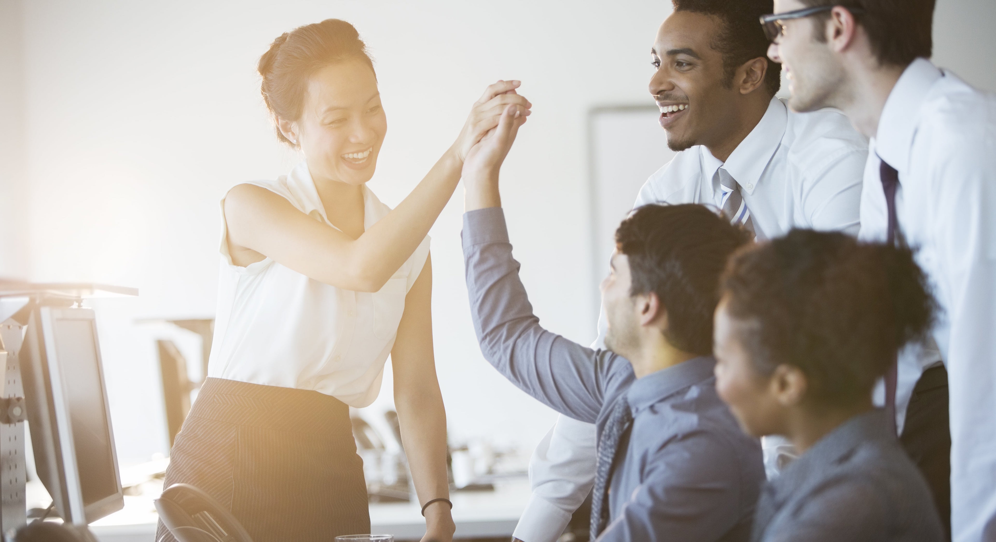 Business people cheering in an office